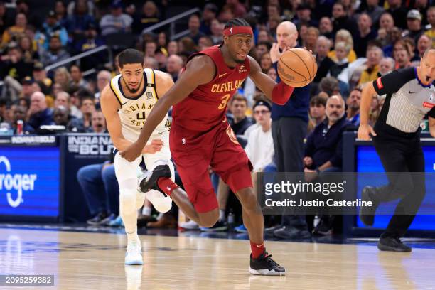 Caris LeVert of the Cleveland Cavaliers steals the ball from Tyrese Haliburton of the Indiana Pacers during the first half at Gainbridge Fieldhouse...