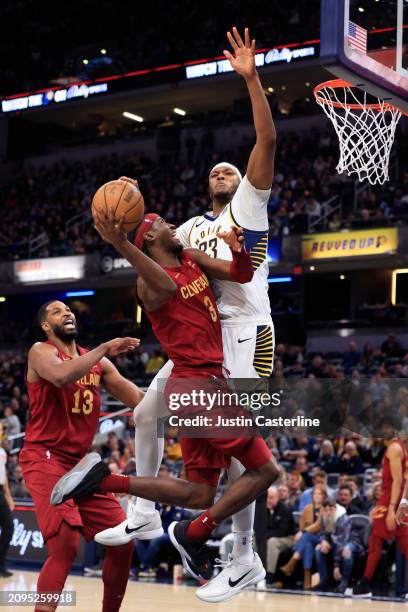 Caris LeVert of the Cleveland Cavaliers takes a shot over Myles Turner of the Indiana Pacers at Gainbridge Fieldhouse on March 18, 2024 in...