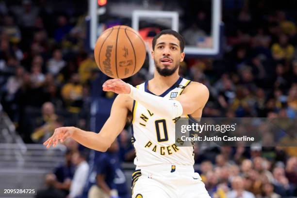 Tyrese Haliburton of the Indiana Pacers passes the ball during the second half against the Cleveland Cavaliers at Gainbridge Fieldhouse on March 18,...