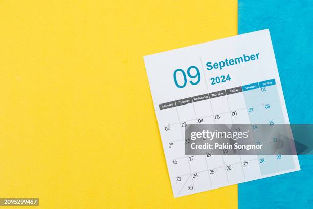desk calendar 2024: september calendar is used to plan daily work and life with two-tone background. - september stock pictures, royalty-free photos & images
