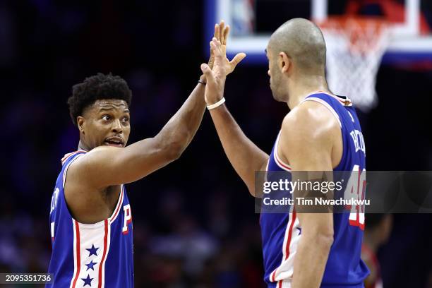 Kyle Lowry and Nicolas Batum of the Philadelphia 76ers react during the fourth quarter against the Miami Heat at the Wells Fargo Center on March 18,...