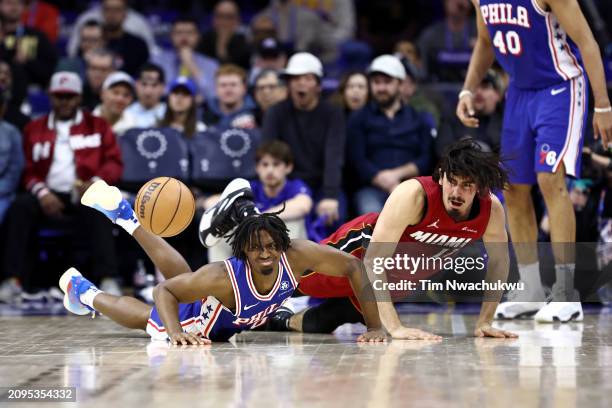 Tyrese Maxey of the Philadelphia 76ers and Jaime Jaquez Jr. #11 of the Miami Heat challenge for the ball during the fourth quarter at the Wells Fargo...