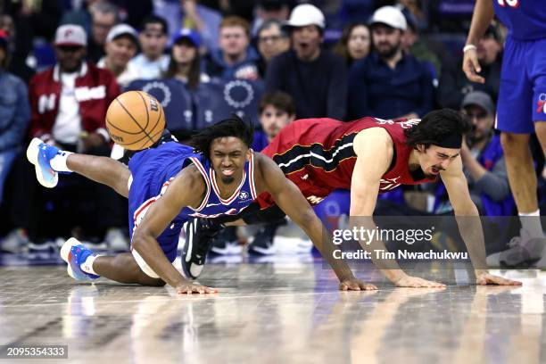 Tyrese Maxey of the Philadelphia 76ers and Jaime Jaquez Jr. #11 of the Miami Heat challenge for the ball during the fourth quarter at the Wells Fargo...