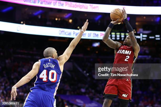 Terry Rozier of the Miami Heat shoots over Nicolas Batum of the Philadelphia 76ers during the fourth quarter at the Wells Fargo Center on March 18,...