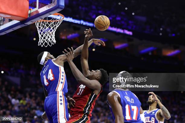 Paul Reed of the Philadelphia 76ers blocks Thomas Bryant of the Miami Heat during the third quarter at the Wells Fargo Center on March 18, 2024 in...