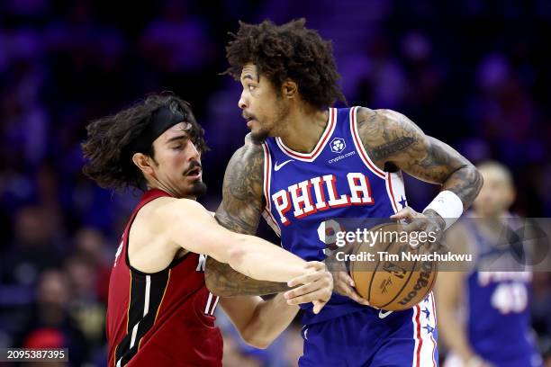 Jaime Jaquez Jr. #11 of the Miami Heat guards Kelly Oubre Jr. #9 of the Philadelphia 76ers during the third quarter at the Wells Fargo Center on...