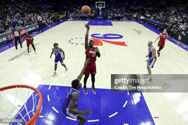 Bam Adebayo of the Miami Heat shoots over Mo Bamba of the Philadelphia 76ers during the third quarter at the Wells Fargo Center on March 18, 2024 in...