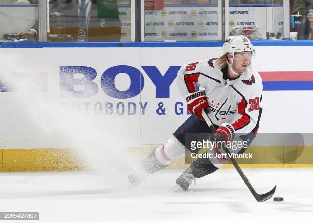 Rasmus Sandin of the Washington Capitals skates up ice during their NHL game against the Vancouver Canucks at Rogers Arena on March 16, 2024 in...
