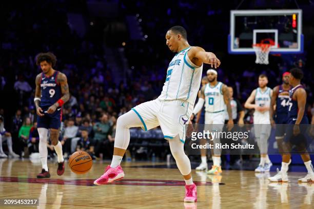 Grant Williams of the Charlotte Hornets kicks the ball during a game against the Philadelphia 76ers at the Wells Fargo Center on March 16, 2024 in...