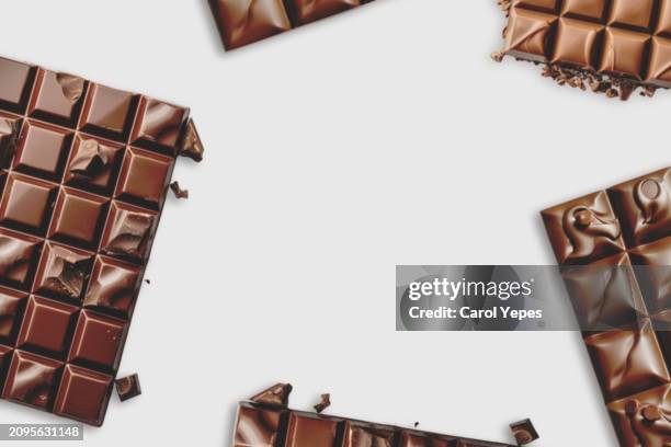 chocolate frame in white.top view - milk chocolate stock pictures, royalty-free photos & images