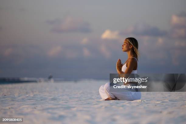 meditating on the beach! - meeru island stockfoto's en -beelden