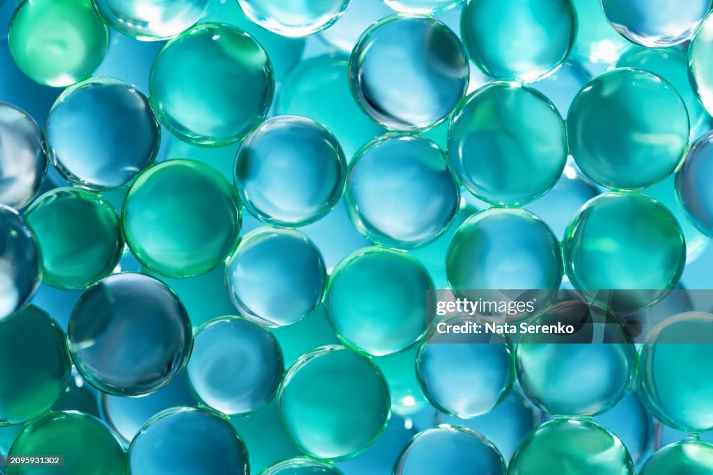 Close-up of aqua beads creating a serene, textured background.
