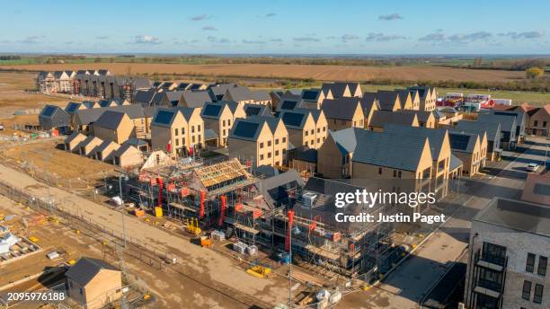 drone view of a residential building site under construction - green roof stock pictures, royalty-free photos & images