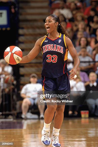 Niele Ivey of the Indiana Fever drives against the Sacramento Monarchs during the WNBA game at ARCO arena on June 14, 2003 in Sacramento, California....