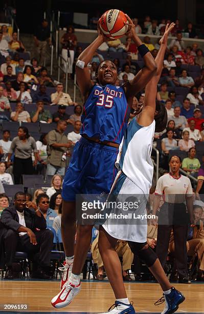 Cheryl Ford of the Detroit Shock puts a shot up over of Ruth Riley of the Washington Mystics during the game on June 14, 2003 at MCI Center in...