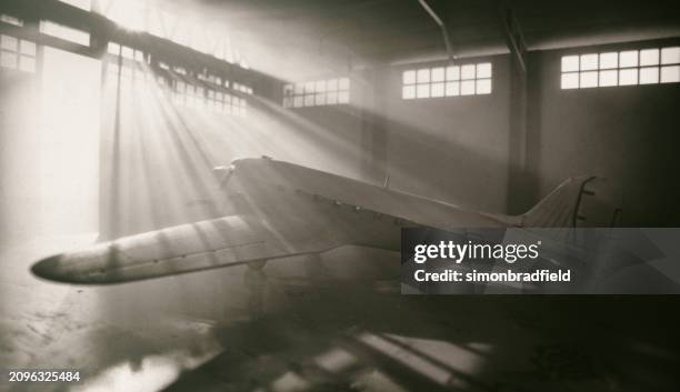 model dc-3 dakota in aircraft hangar - antique airplane stock pictures, royalty-free photos & images