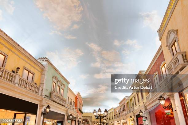 artificial cloud sky in the villaggio mall in doha. - canal disney stock pictures, royalty-free photos & images