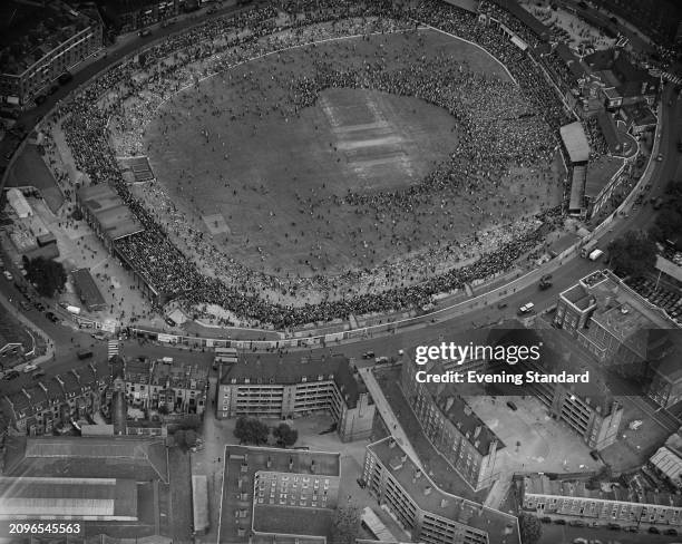 An aerial view of The Oval cricket ground with a large crowd of spectators on the field during the 5th Test of the Ashes between England and...