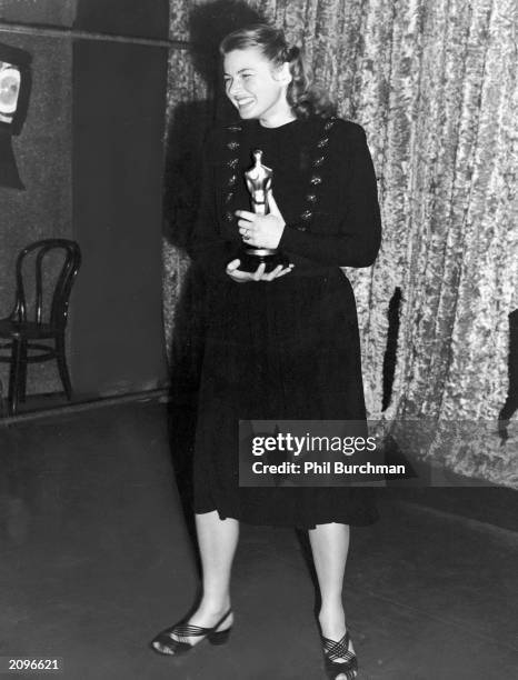 Swedish-born actor Ingrid Bergman holds her Oscar for Best Actress for her role in the film 'Gaslight,' at the Academy Awards, Hollywood, California,...