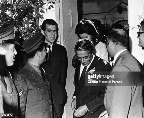 Jaqueline Kennedy Onassis and her new husband, Greek shipping magnate Aristotle Onassis leave the chapel shortly after their wedding ceremony on the...