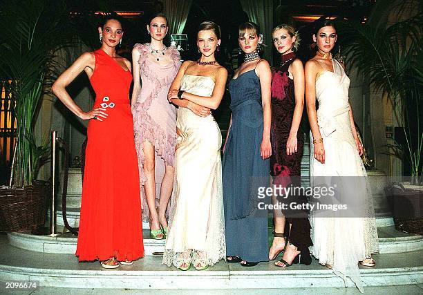 Models attend a fashion show organised by Fawaz Grossi showcasing Galliano designs and Maison de Grisogne jewellery June 18, 2003 in Paris, France.