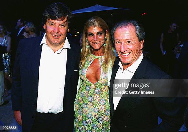 Guests attend a fashion show organised by Fawaz Grossi showcasing Galliano designs and Maison de Grisogne jewellery June 18, 2003 in Paris, France.