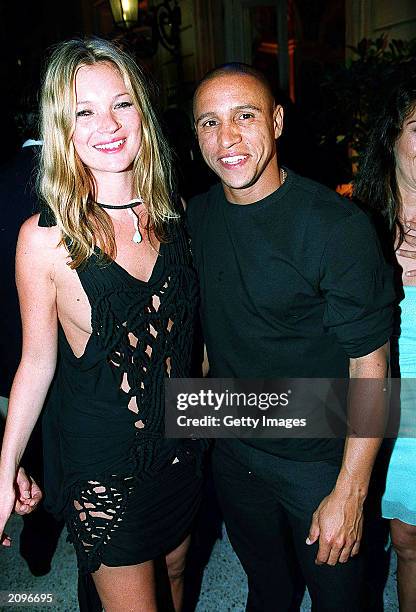 Model Kate Moss and footballer Roberto Carlos attend a fashion show organised by Fawaz Grossi showcasing Galliano designs and Maison de Grisogne...