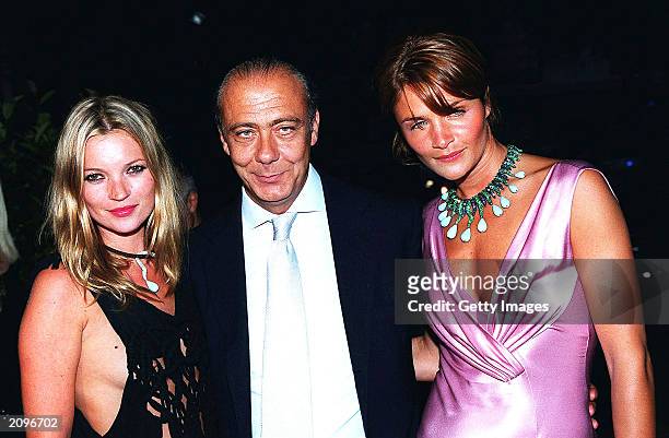 Model Kate Moss, Fawaz Grossi and model Helena Christensen attend a fashion show organised by Fawaz Grossi showcasing Galliano designs and Maison de...