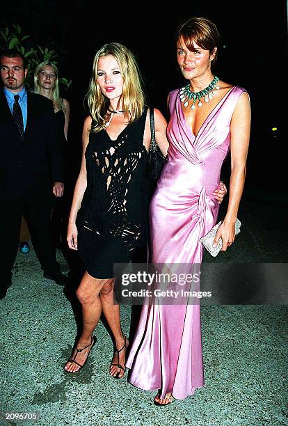 Models Kate Moss and Helena Christensen attend a fashion show organised by Fawaz Grossi showcasing Galliano designs and Maison de Grisogne jewellery...