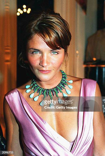 Model Helena Christensen attends a fashion show organised by Fawaz Grossi showcasing Galliano designs and Maison de Grisogne jewellery June 18, 2003...