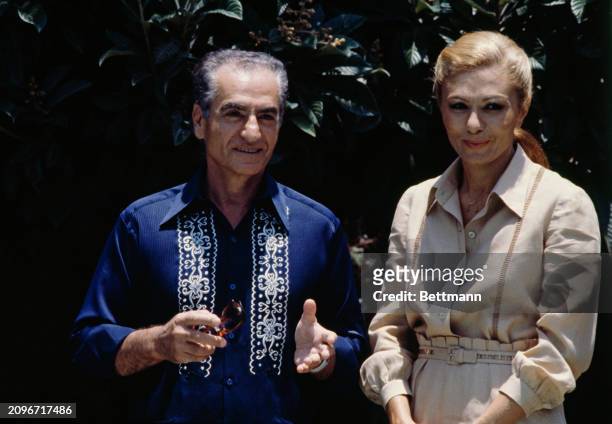 Shah Mohammed Reza Pahlavi of Iran and his wife, Empress Farah, posing in the garden of a friend's house in Cuernavaca, Mexico, June 13th 1979.