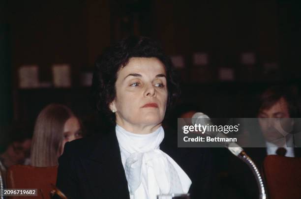 Dianne Feinstein , the Mayor of San Francisco, wearing a large white bow around her neck during an appearance before the Senate Finance Committee in...