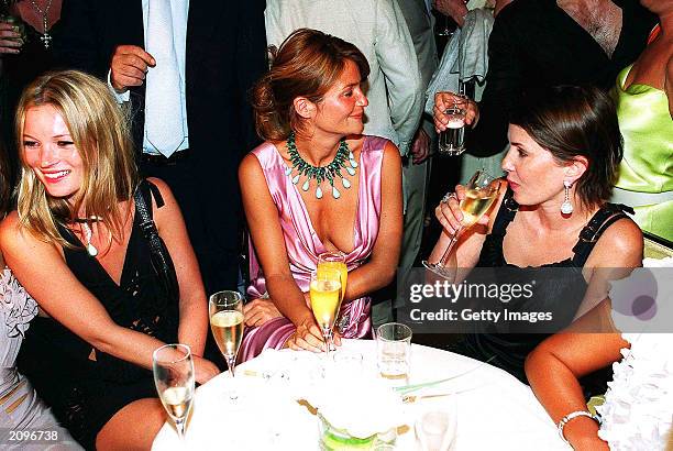 Model Kate Moss, model Helena Christensen and actress Sadie Frost attend a fashion show organised by Fawaz Grossi showcasing Galliano designs and...