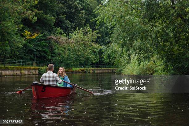 rowing romance - rowboat stock pictures, royalty-free photos & images