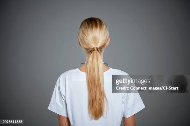 rear view of young woman with ponytail - hair back stock pictures, royalty-free photos & images