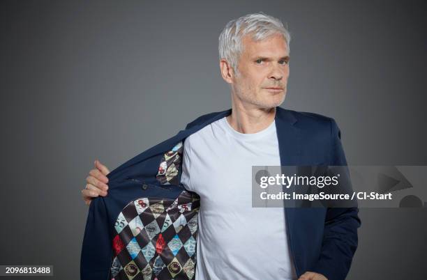 portrait of a mature man wearing a blazer - gray blazer stock pictures, royalty-free photos & images