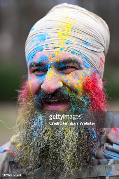 Major Harj Singh Shergill celebrates with Rang, the throwing of coloured powder, on March 19, 2024 in Aldershot, England. Holla Mahalla, the annual...