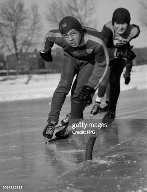 Paul Heiges leads as Bruce Larson attempts to overtake during the Laidlaw Post American Legion skating meet at Powderhorn Park, Minneapolis, 1957.