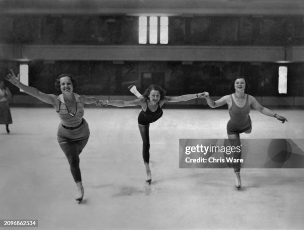 Three women wearing bathing costumes at Streatham Ice Rink, London, 19th August 1932.