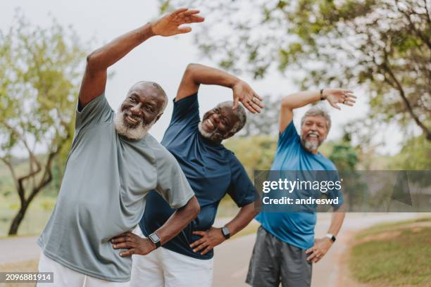 group of elderly friends exercising by stretching - aerobics bildbanksfoton och bilder