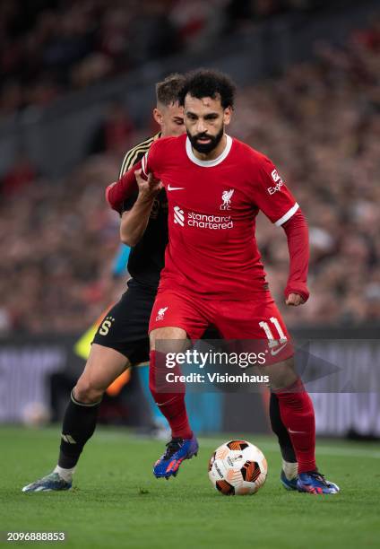 Mohamed Salah of Liverpool and Matej Rynes of Sparta Praha in action during the UEFA Europa League 2023/24 round of 16 second leg match between...