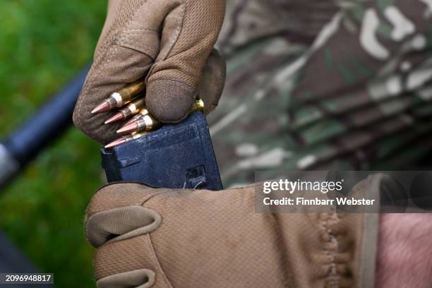 Live ammunition is loaded into a gun magazine during the shooting competition during the Holla Mahalla Sikh military festival on March 19, 2024 in...