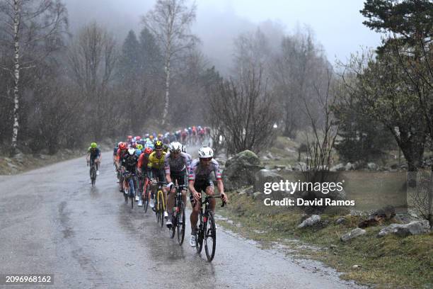 Marc Soler of Spain and Joao Almeida of Portugal and UAE Emirates Team lead the peloton in heavy rain during the 103rd Volta Ciclista a Catalunya...