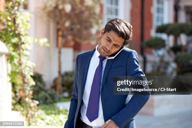 businessman speaking during meeting - gray blazer stock pictures, royalty-free photos & images