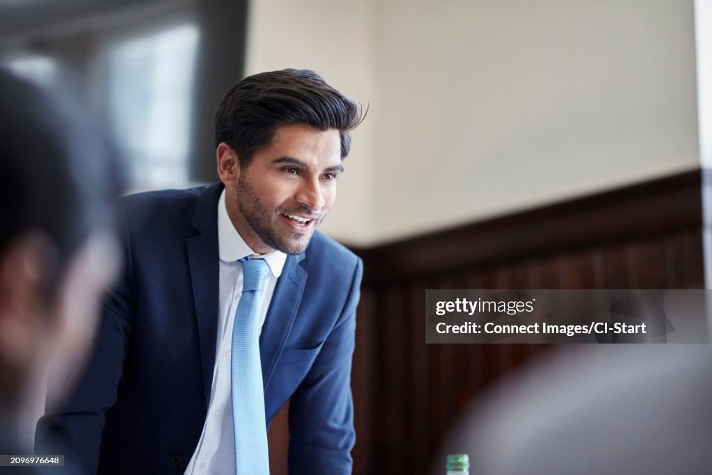 Businessman speaking at meeting