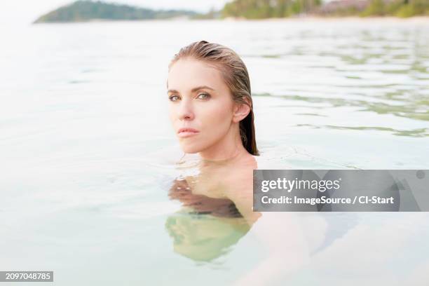 young woman with wet hair in sea - hot blondes images stock pictures, royalty-free photos & images