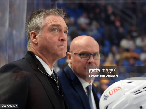 Head coach Patrick Roy and assistant coach John MacLean of the New York Islanders watch the action during an NHL game against the Buffalo Sabres on...