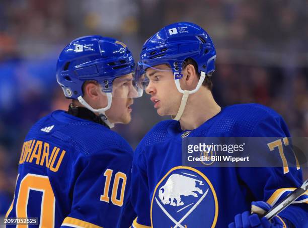 Henri Jokiharju and JJ Peterka of the Buffalo Sabres prepare for a faceoff during an NHL game against the New York Islanders on March 14, 2024 at...