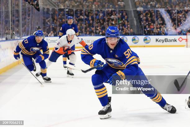 Eric Robinson and Tyson Jost of the Buffalo Sabres skates during an NHL game against the New York Islanders on March 14, 2024 at KeyBank Center in...