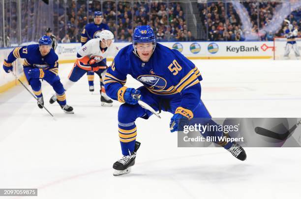 Eric Robinson and Tyson Jost of the Buffalo Sabres skates during an NHL game against the New York Islanders on March 14, 2024 at KeyBank Center in...